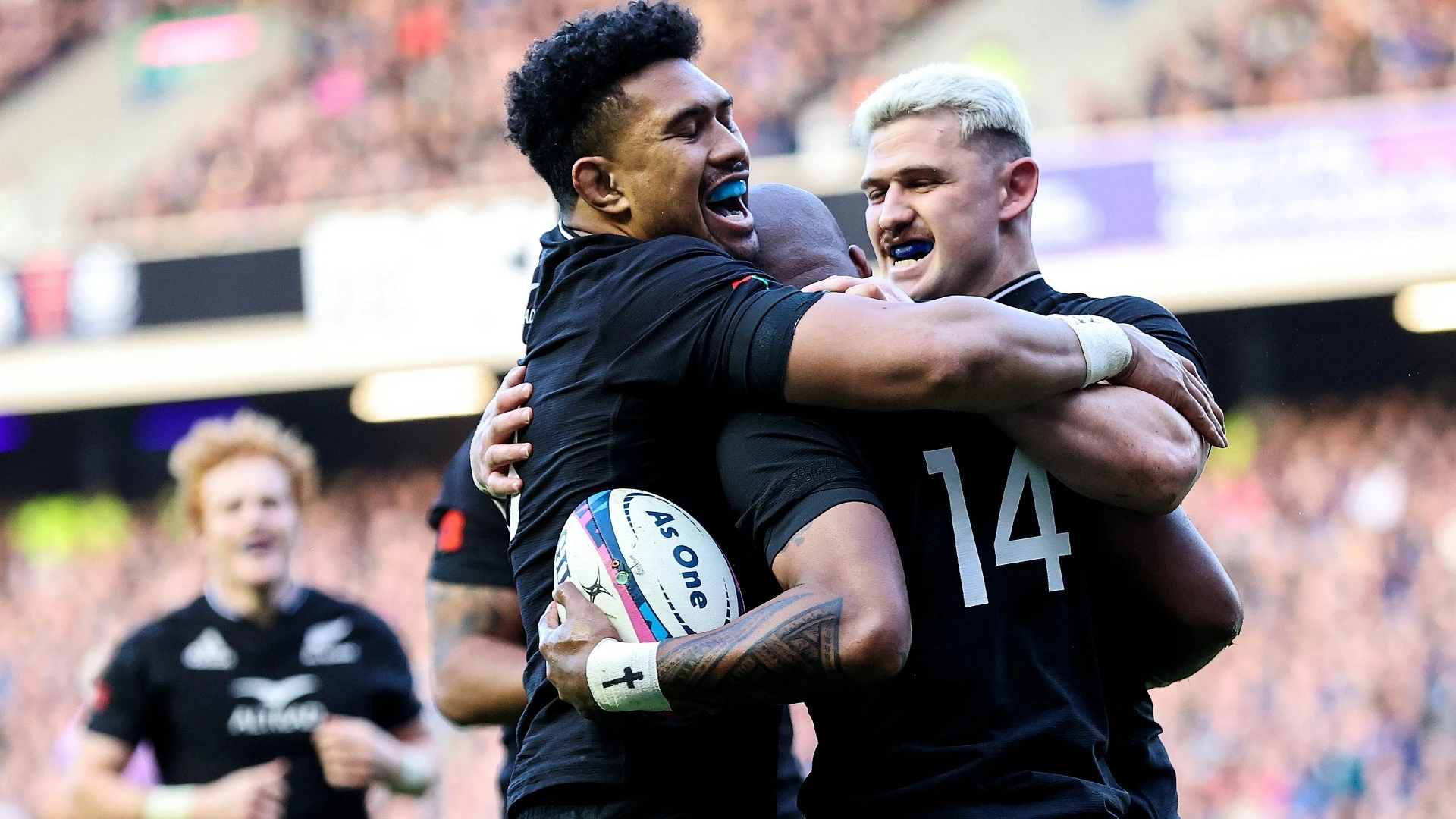 Ardie Savea and Dalton Papalii celebrate with try scorer Mark Telea 13/11/2022