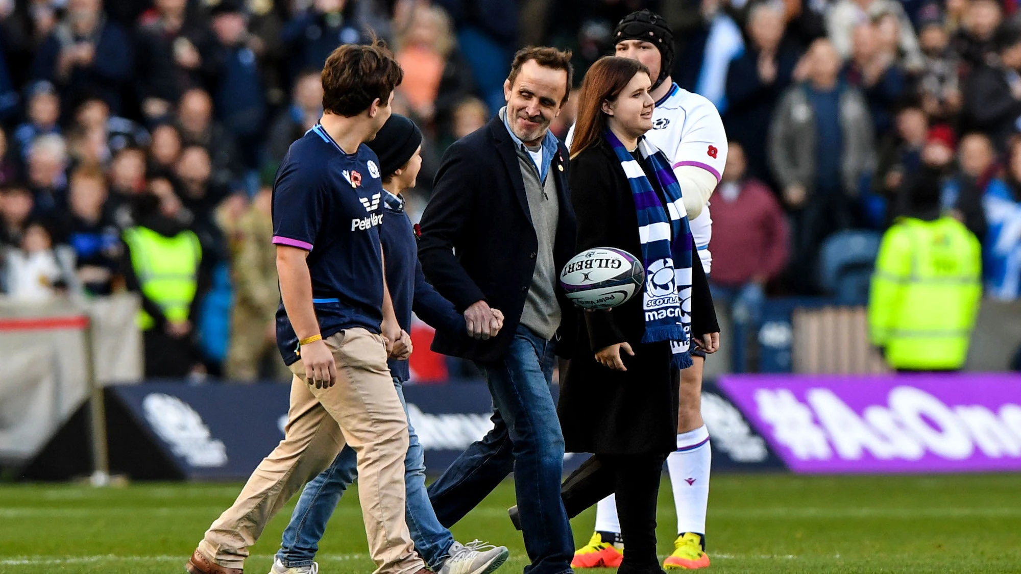 Tom Smith walks out into Murrayfield with the match ball after being inducted into the Scottish Rugby Hall of Fame 13/11/2021