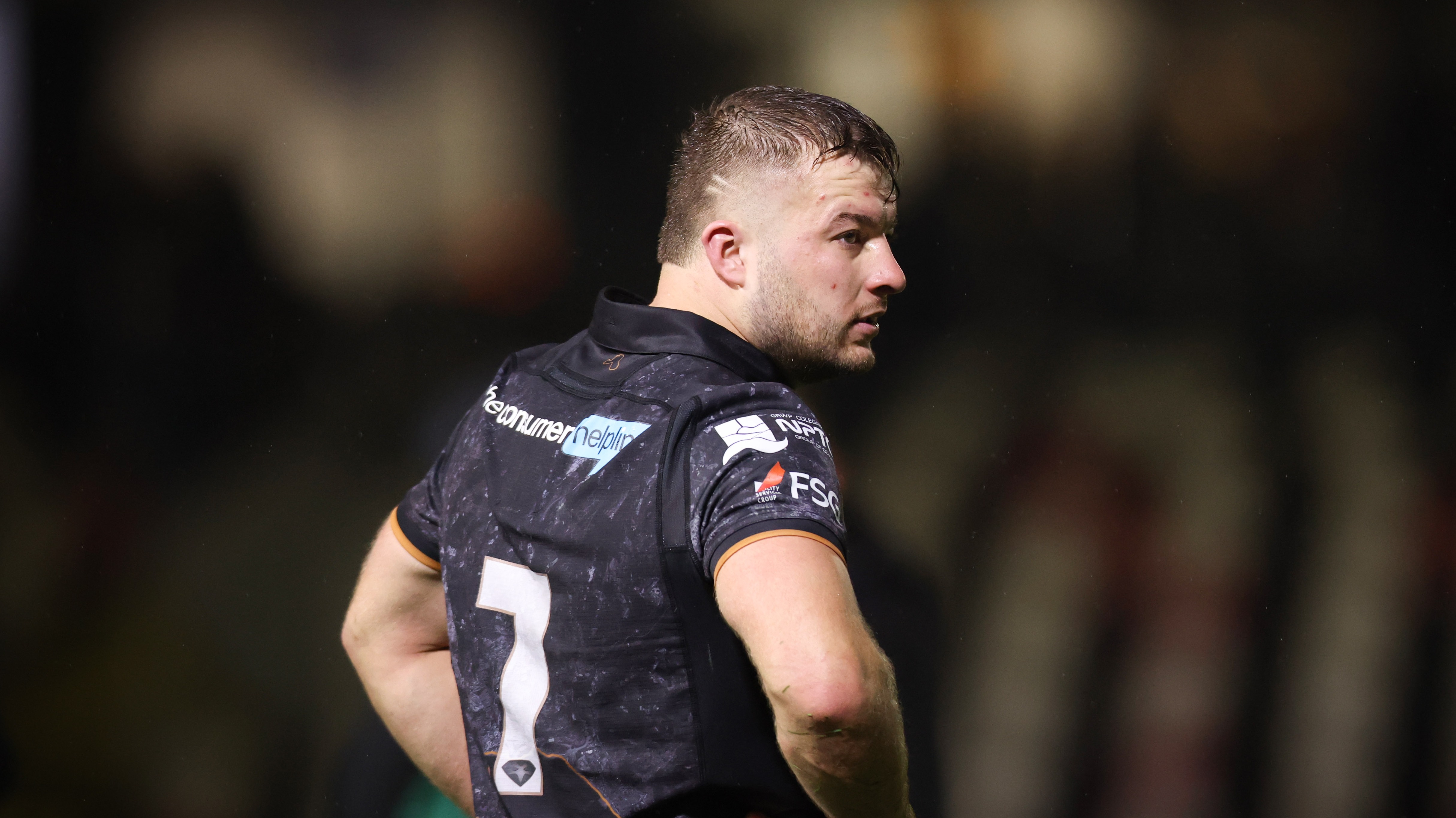 Ospreys' Harri Deaves with hands on hips during the 2025 URC match against Dragons at Rodney Parade.