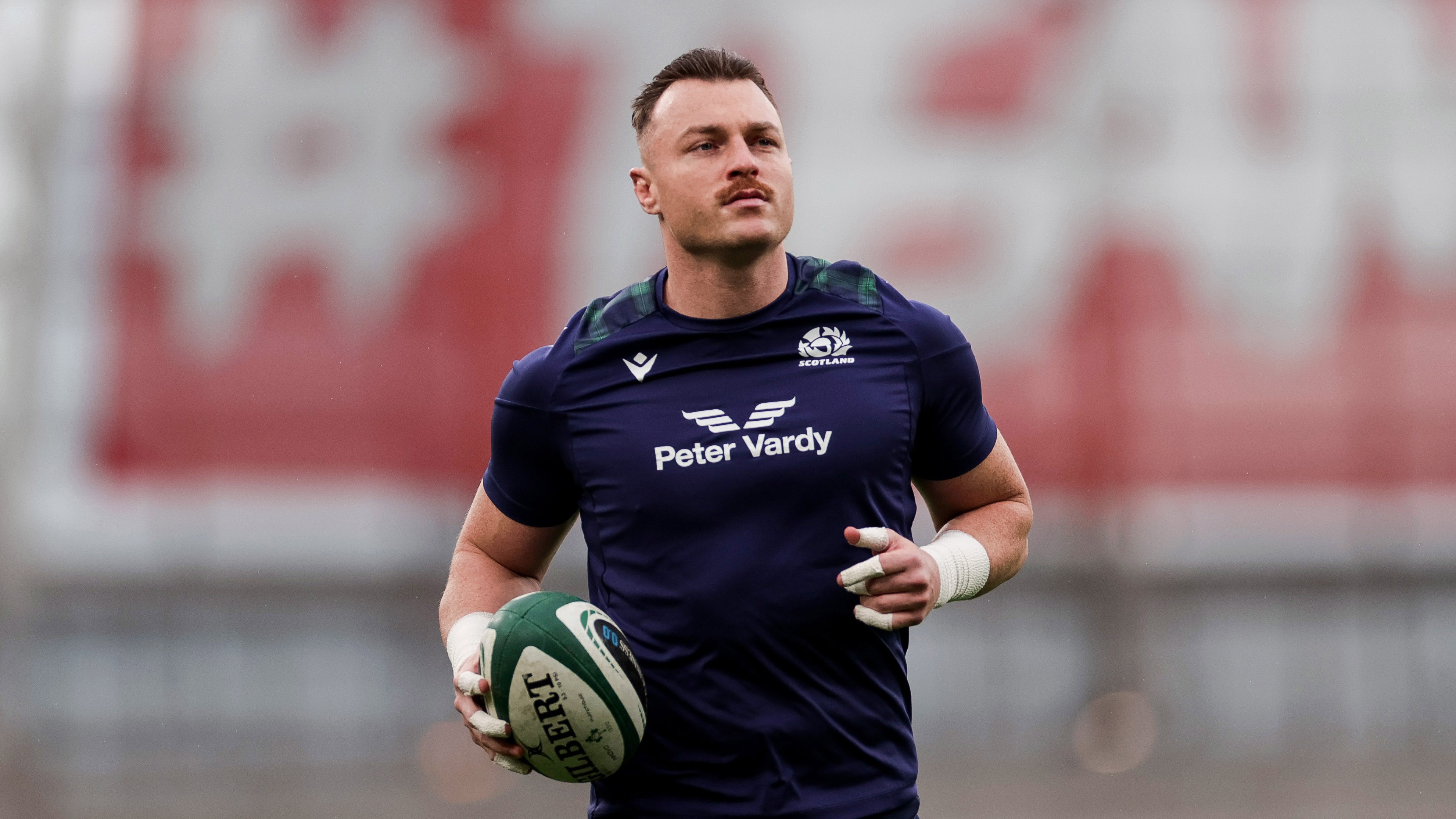 Scotland’s Jack Dempsey warms-up ahead of the 2024 Guinness Six Nations Championship