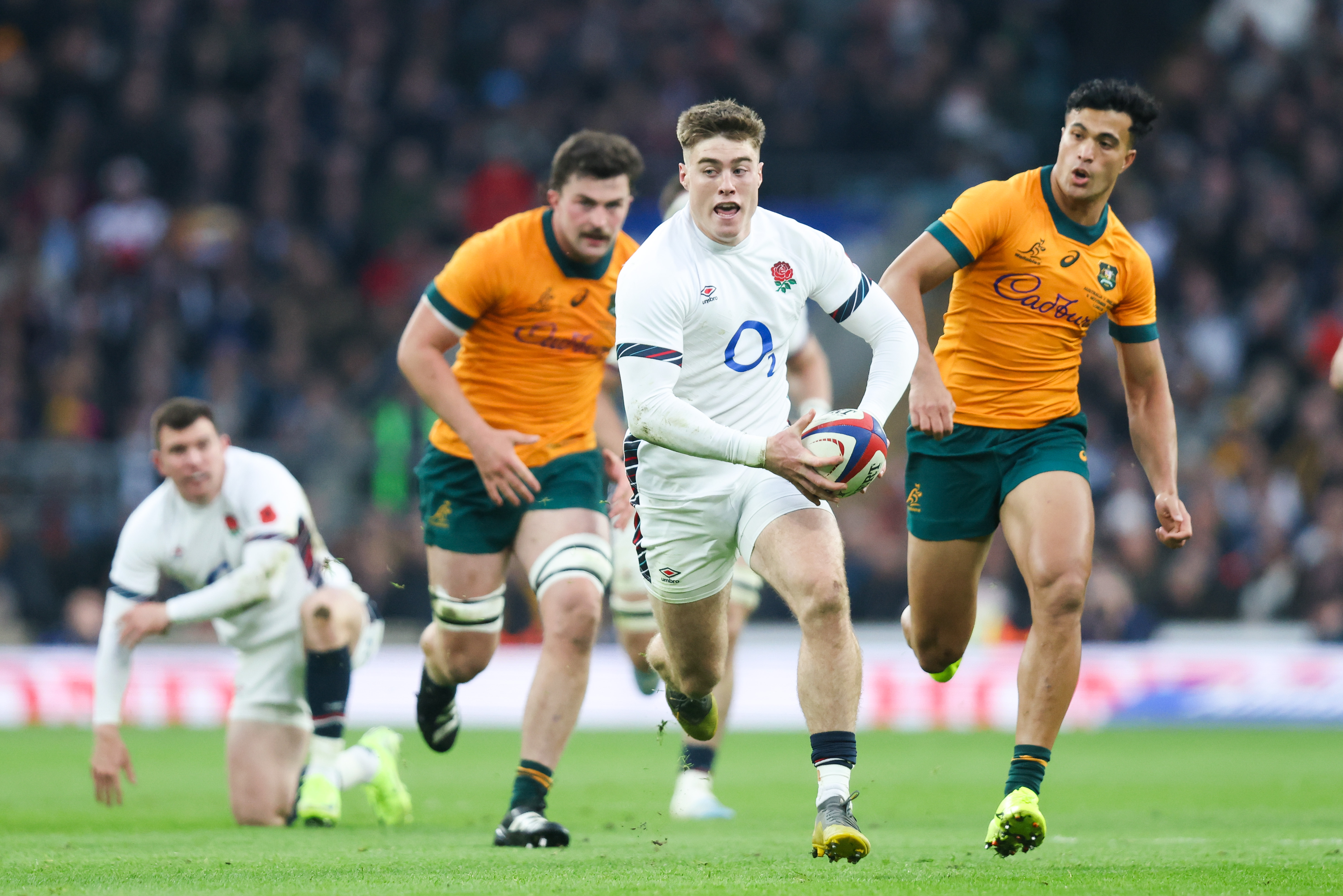 England's Tommy Freeman looks to escape the Wallabies defence in 2024.