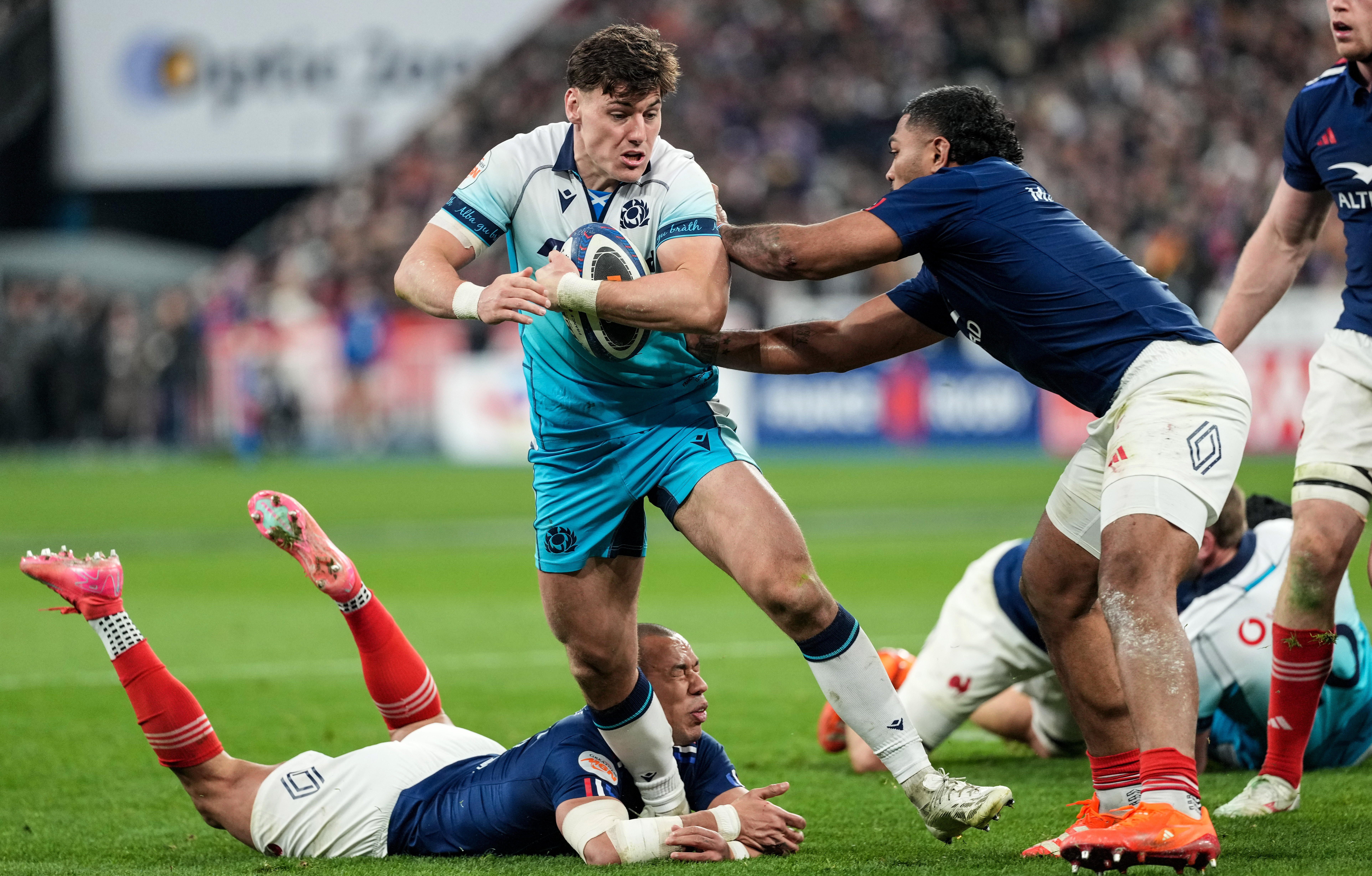 Scotland's Tom Jordan is tackled by France's Peato Mauvaka during the 2025 Championship match.