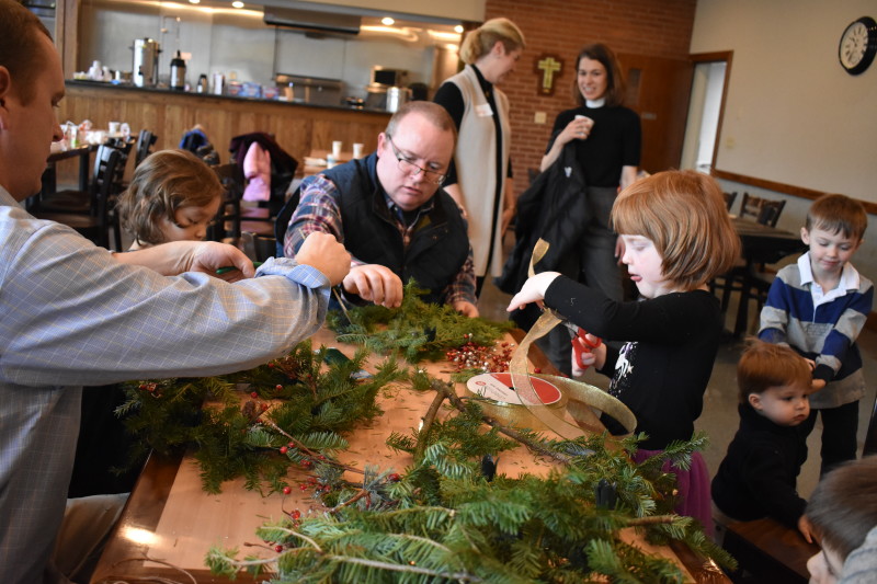 Father and child making an advent wreath