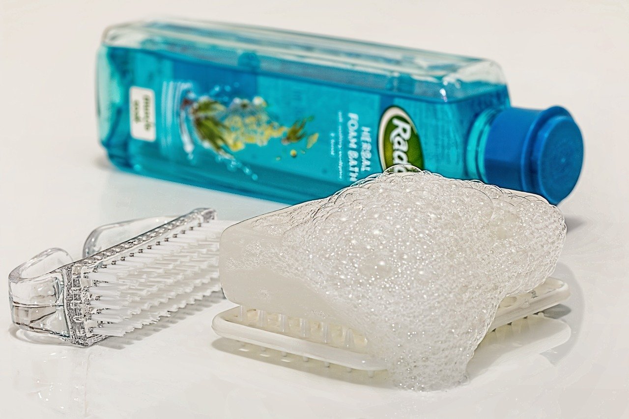 An image of toiletries including mouthwash and soap. 