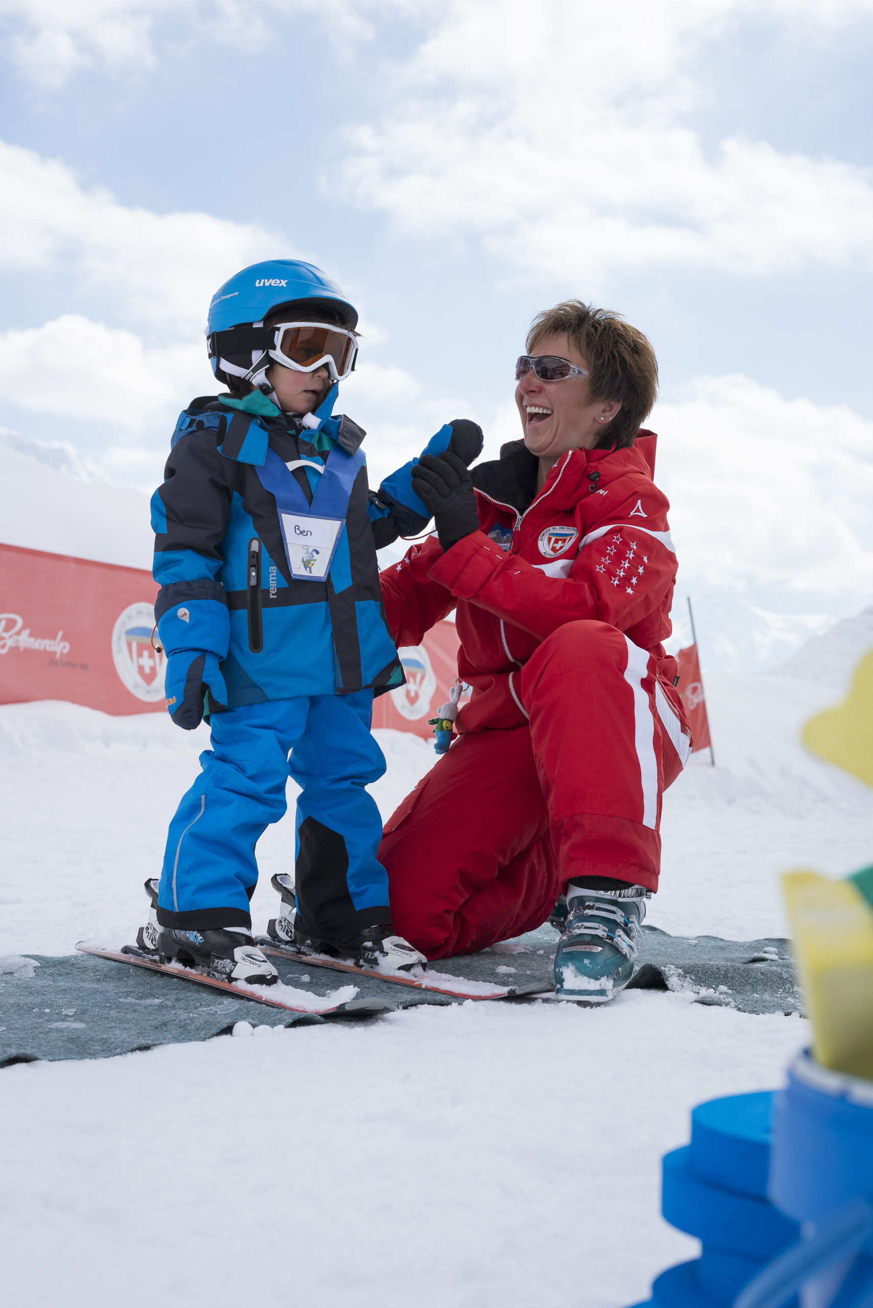 Sabine Haldemann from Bettmeralp laughs with one of her students during ski lessons