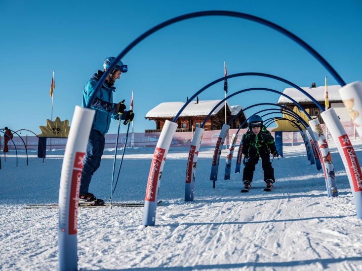 A child learns to ski in the children's snow playground of Riederalp, in Valais, Switzerland.
