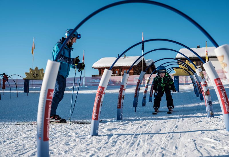 A child learns to ski in the children's snow playground of Riederalp, in Valais, Switzerland.