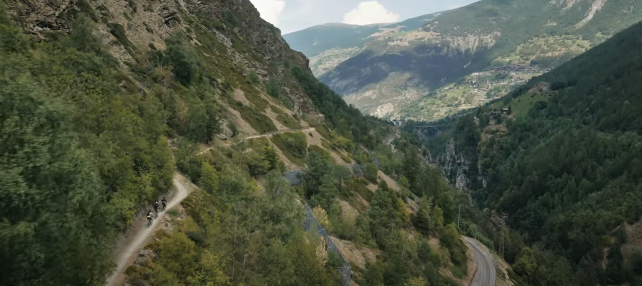 Three mountain bikers on the Valais Alpine Bike route between Graechen and Brig, Valais, Switzerland.