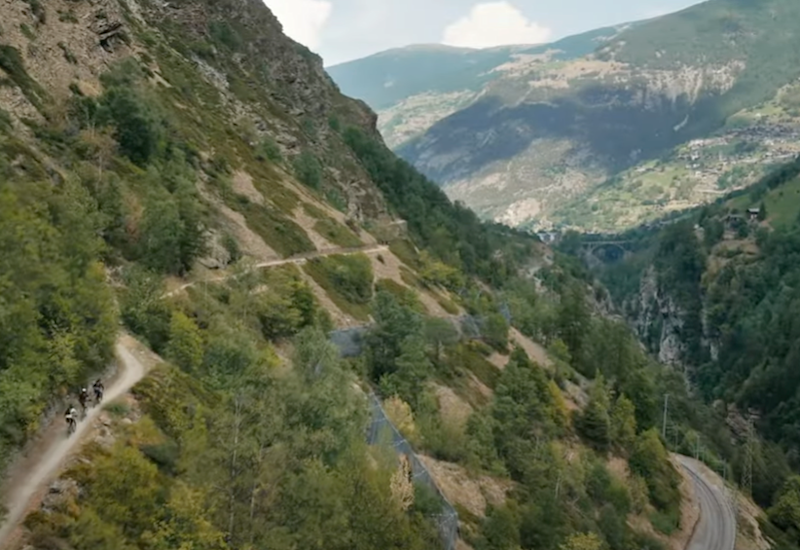 Three mountain bikers on the Valais Alpine Bike route between Graechen and Brig, Valais, Switzerland.