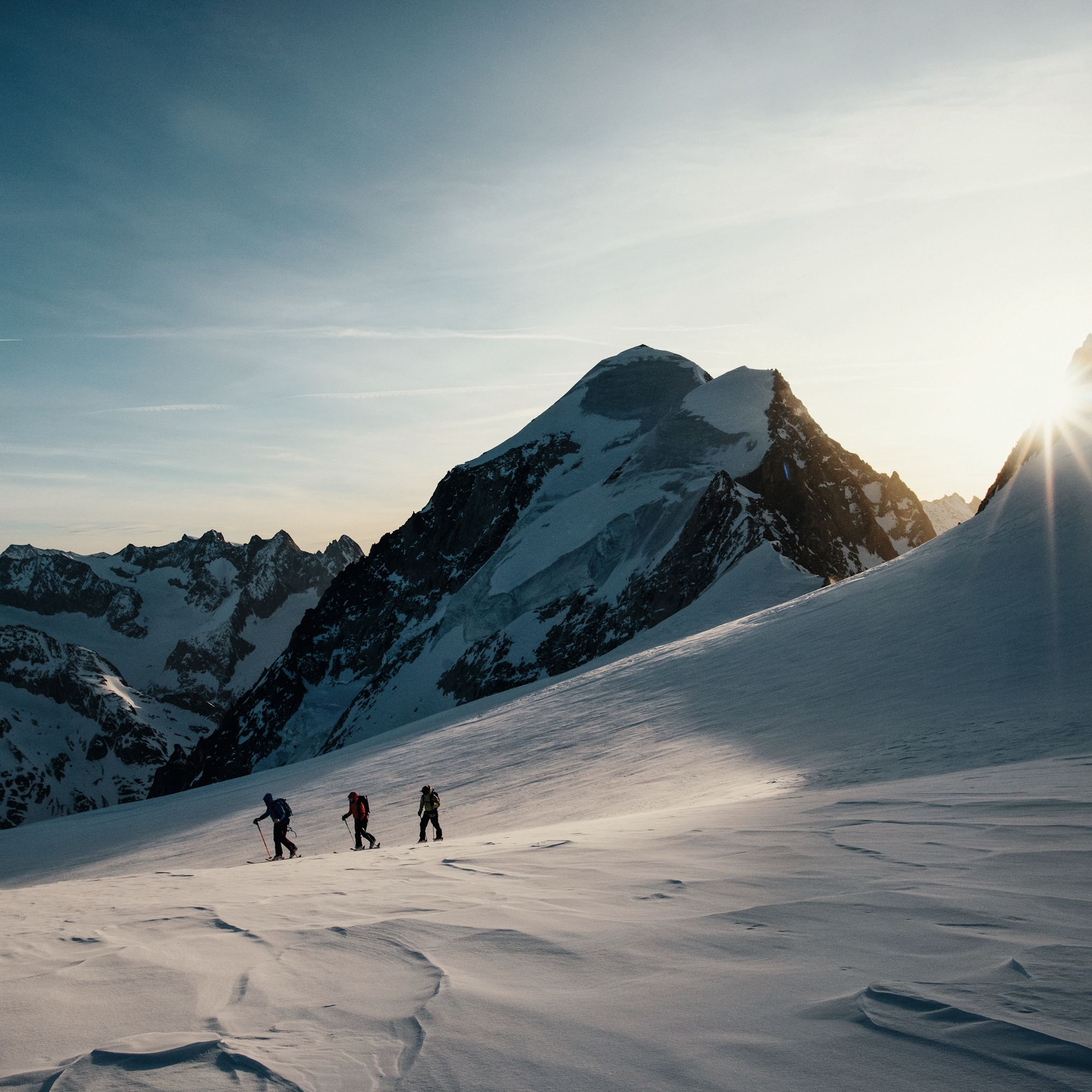 The sun rises on hikers in the Lötschental
