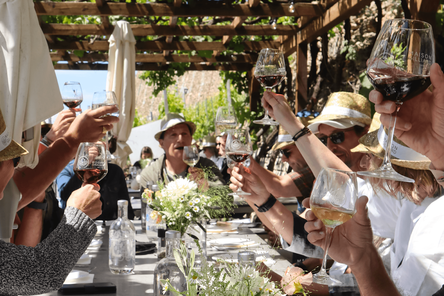 People enjoying a wine tasting at Maison Gilliard in Sion in summer, Valais, Switzerland