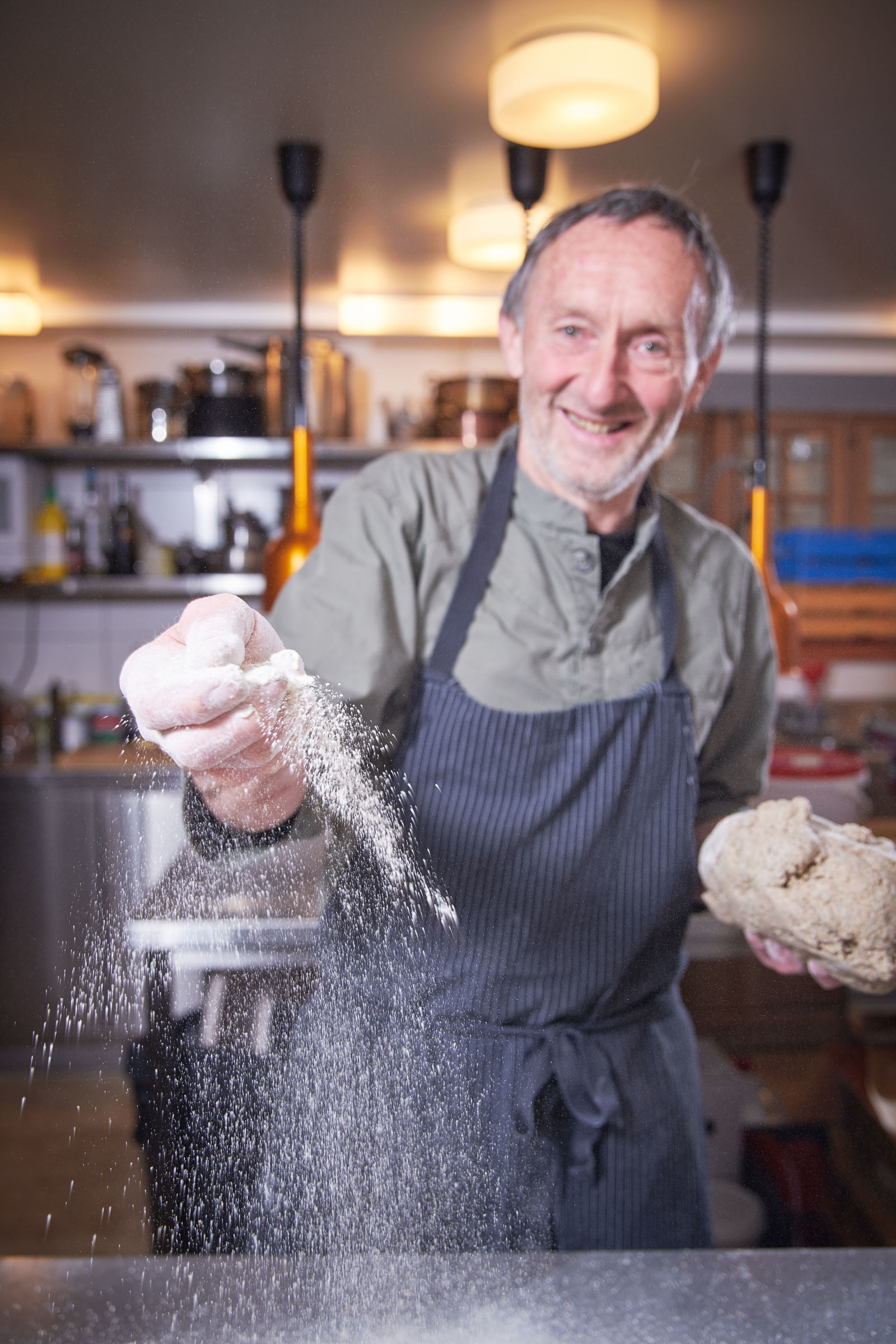 Klaus Leuenberger at work with dough and flour, Valais, Switzerland