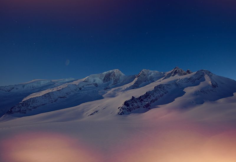 View of the winter landscape at night from the Finsteraahornhütte. Gross Wannenhorn, Schönbühljoch, Schönbühlhorn, Gabelhornsattel, Fiescher Gabelhorn, Winter, Valais, Switzerland