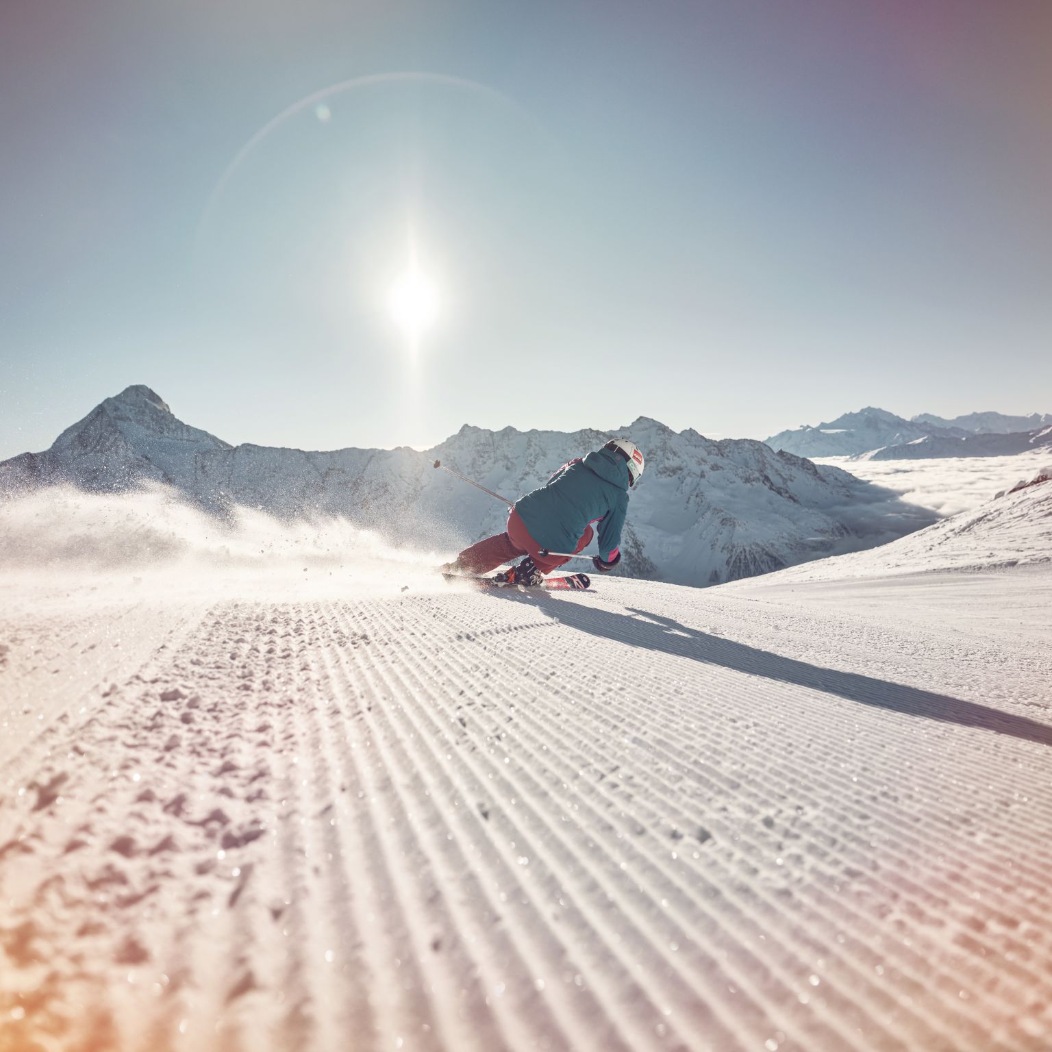A skier facing a sea of fog