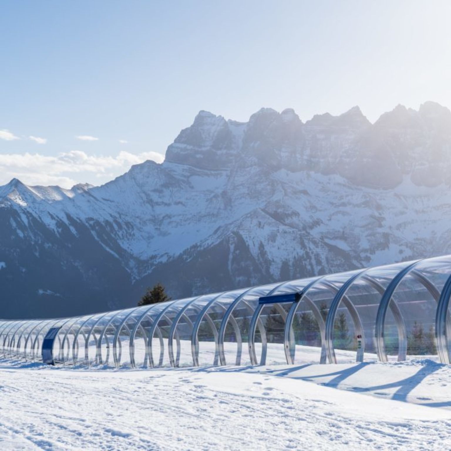 Covered magic carpet in the beginner area of Morgins, ideal for learning to ski safely, with the impressive Dents du Midi in the background.