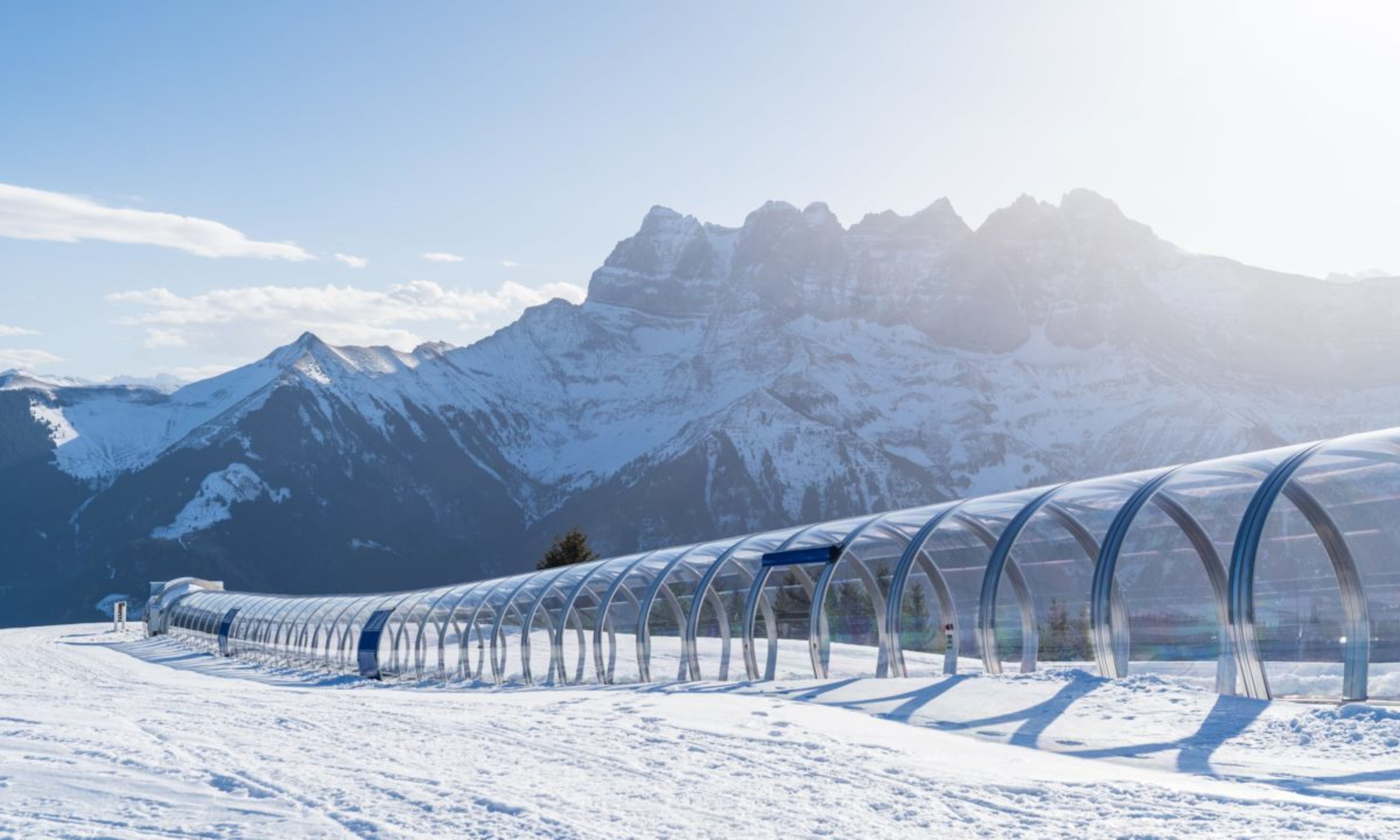 Covered magic carpet in the beginner area of Morgins, ideal for learning to ski safely, with the impressive Dents du Midi in the background.