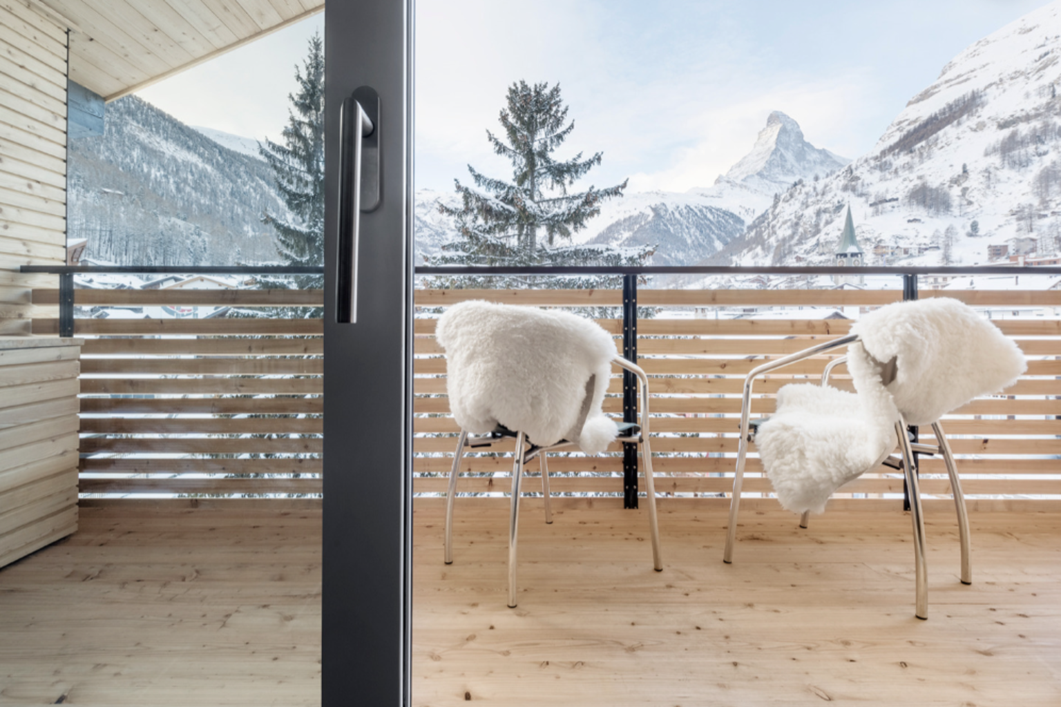 The balcony of an apartment with a view of the Matterhorn
