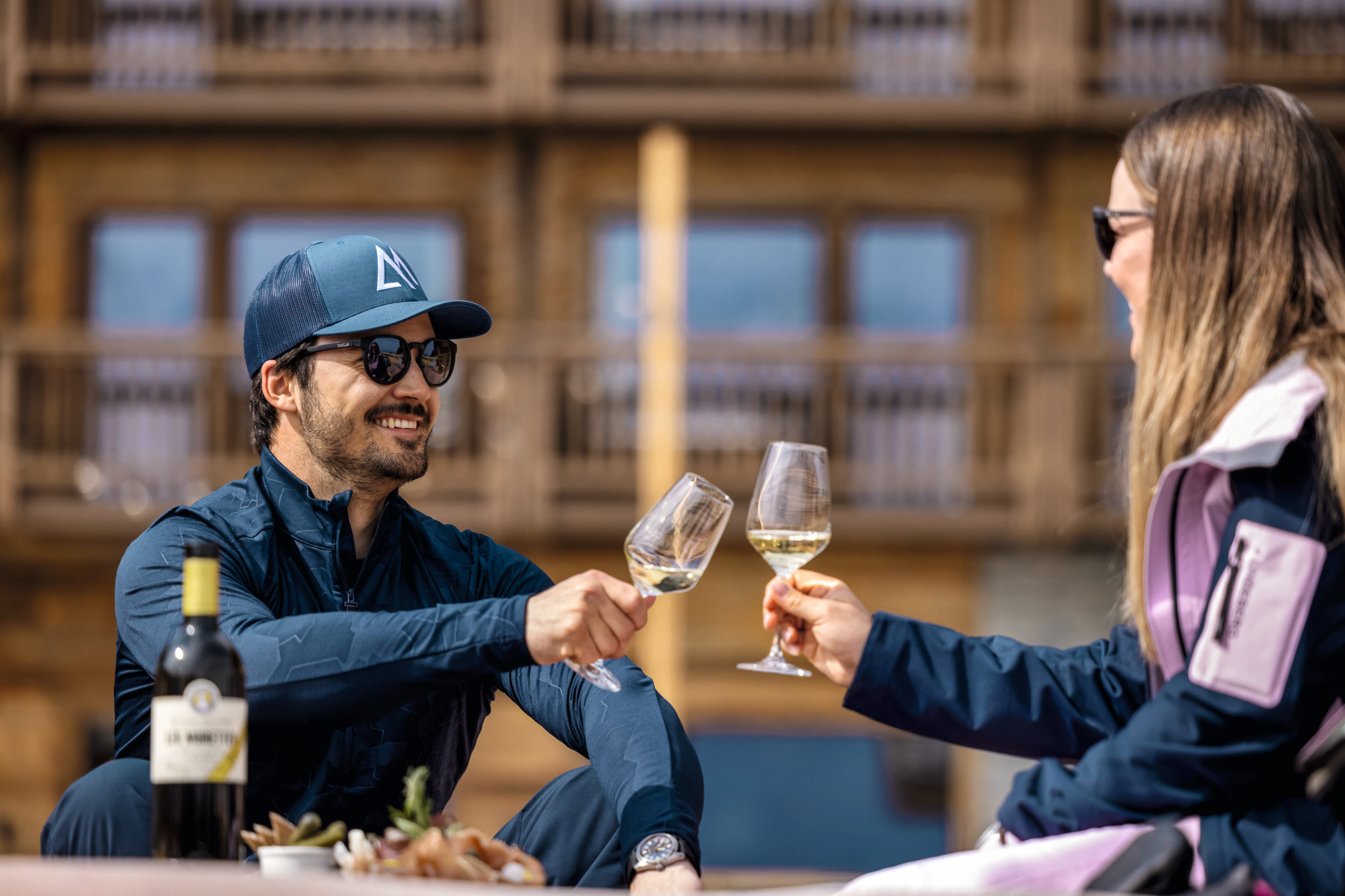 Mélanie and Loic Meillard enjoy a glass of wine on the terrace of the Eringer Hotel in Hérémence.