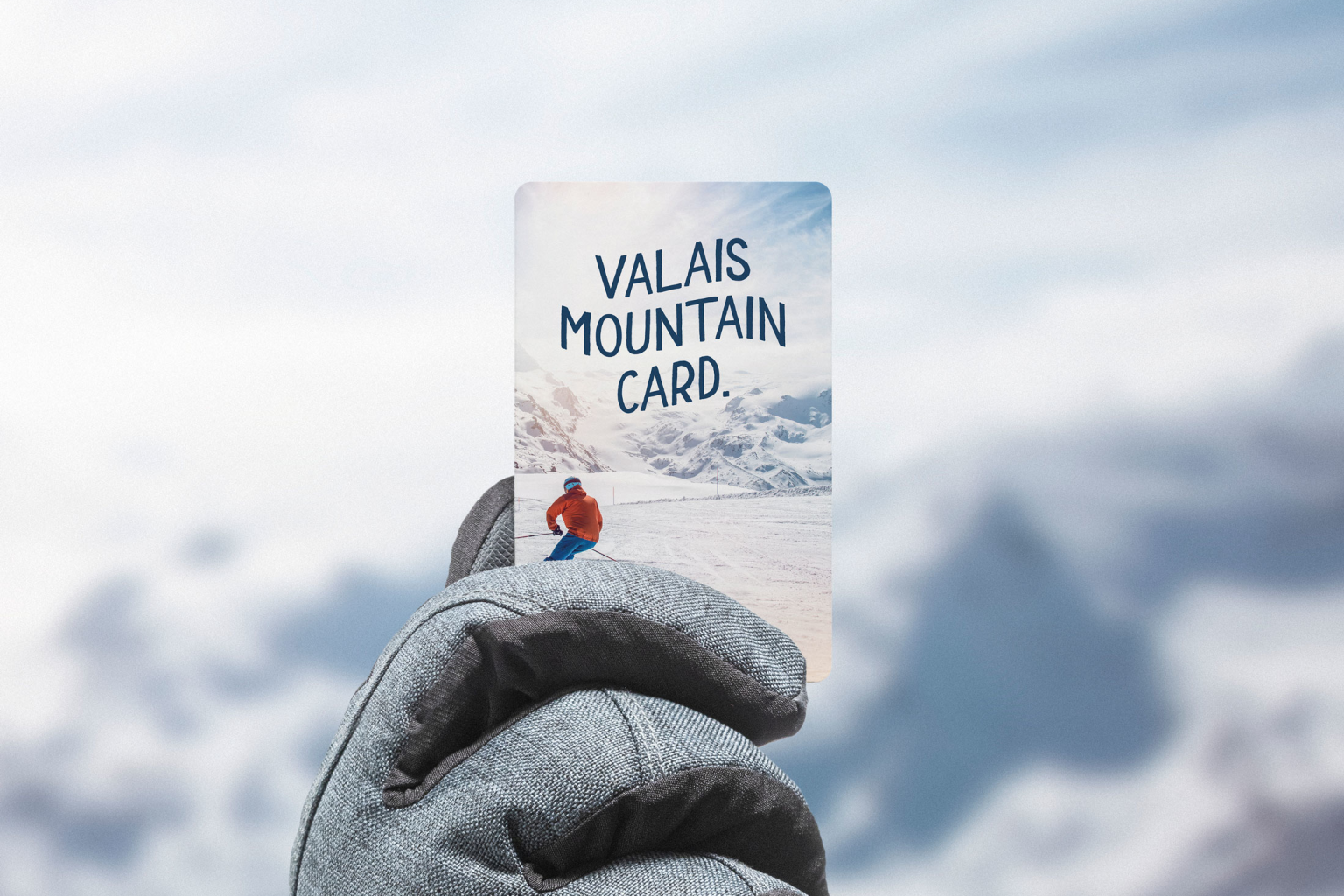 Main avec gant tenant un forfait de ski, Valais, Suisse