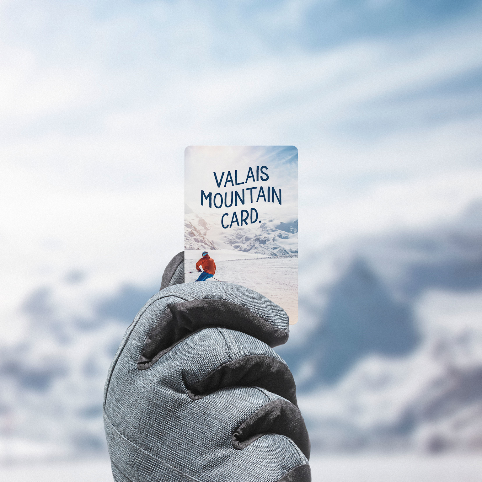 Main avec gant tenant un forfait de ski, Valais, Suisse