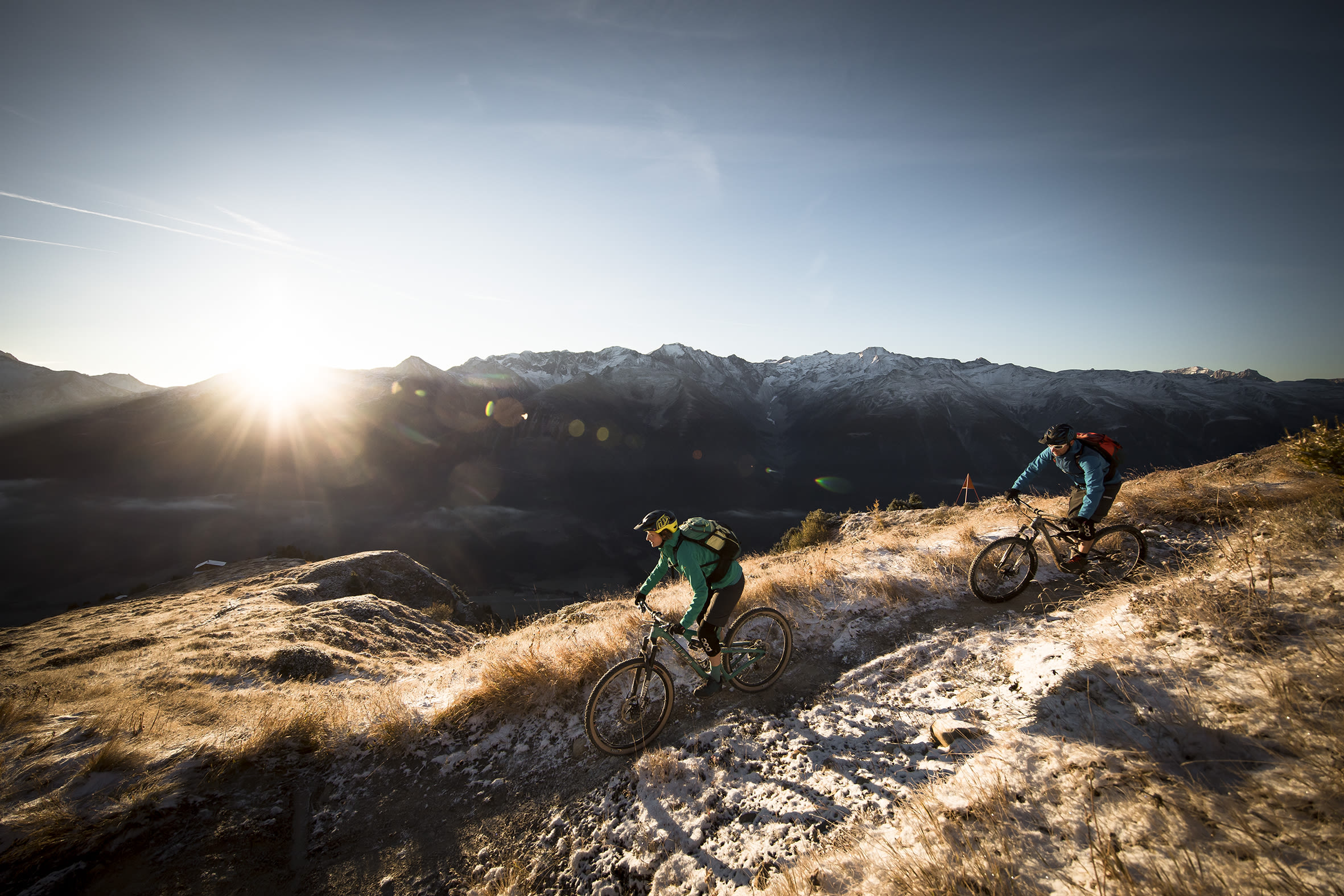 Mountain bikers riding at the Grimselpass, Valais