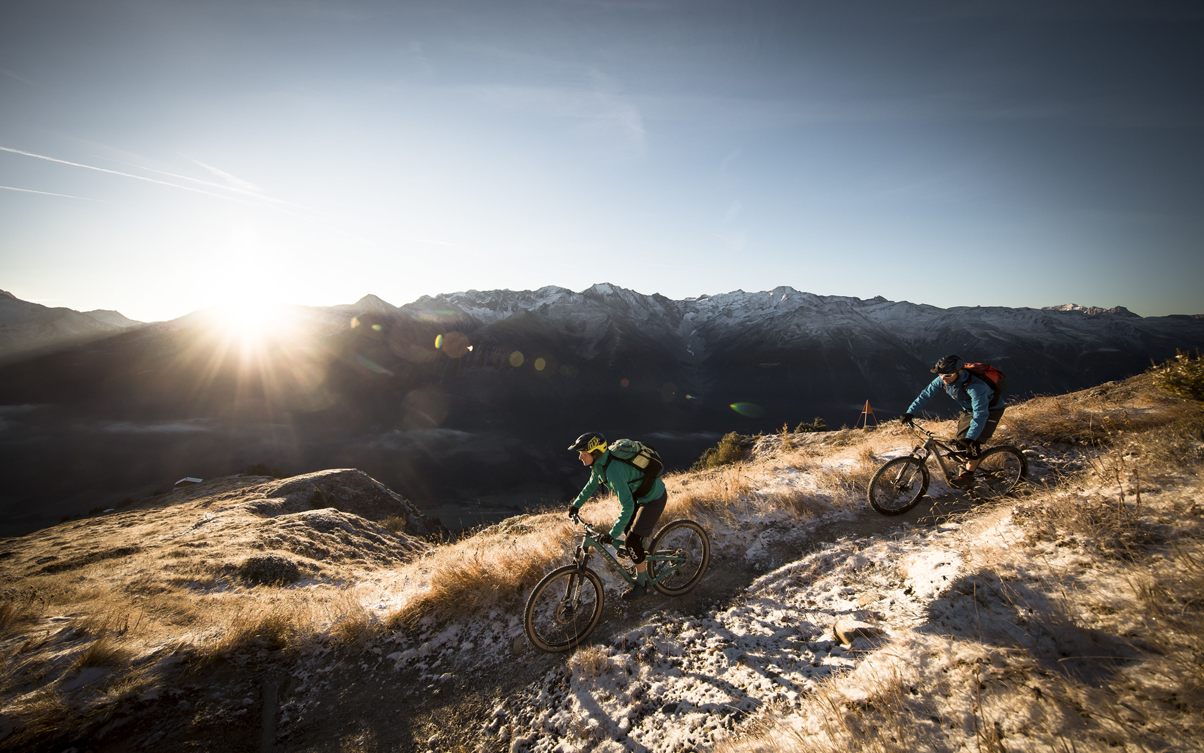 Mountain bikers riding at the Grimselpass, Valais