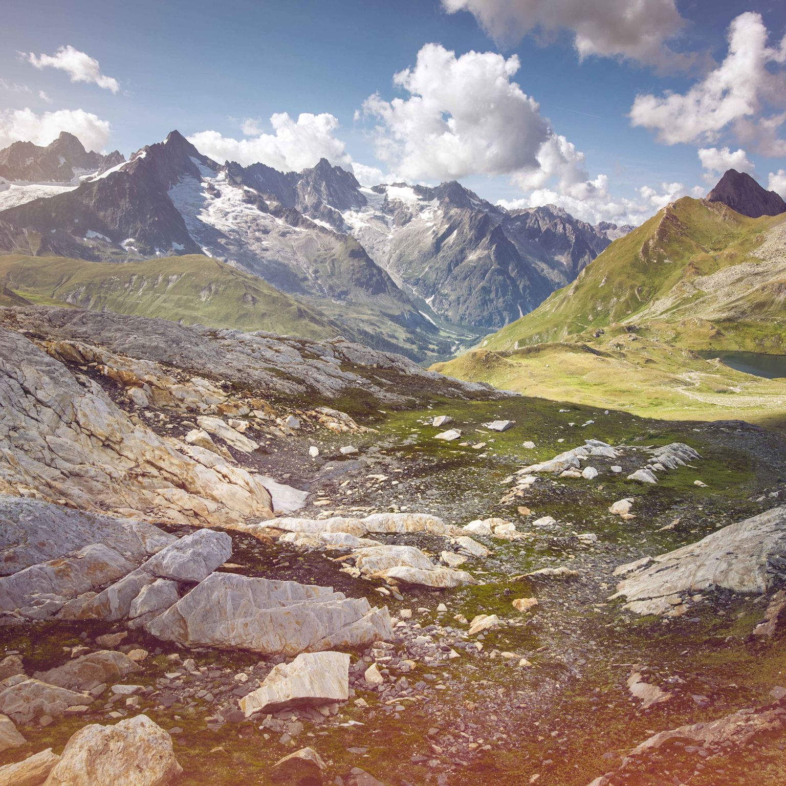 Mountain landscape with stones and lake, Val Ferret, La Fouly, Valais, Switzerland