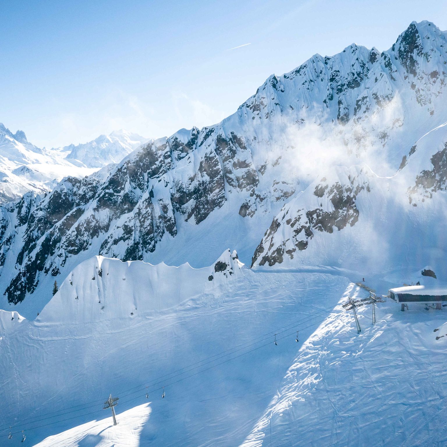 Snow-covered mountain peaks and mountain station in the ski area Les Marécottes - Vallée du Trient
