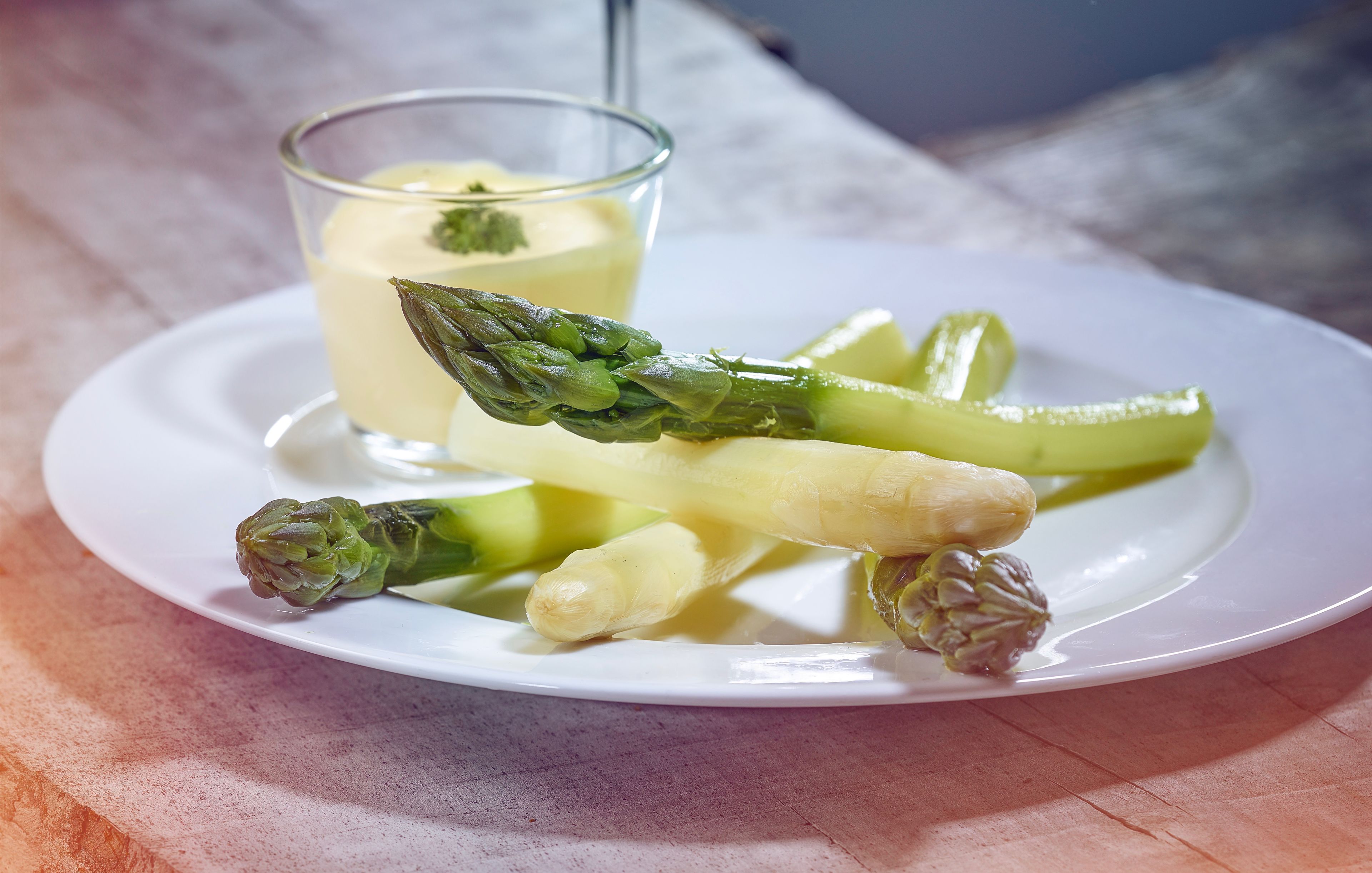 Asparagus on a plate with sauce