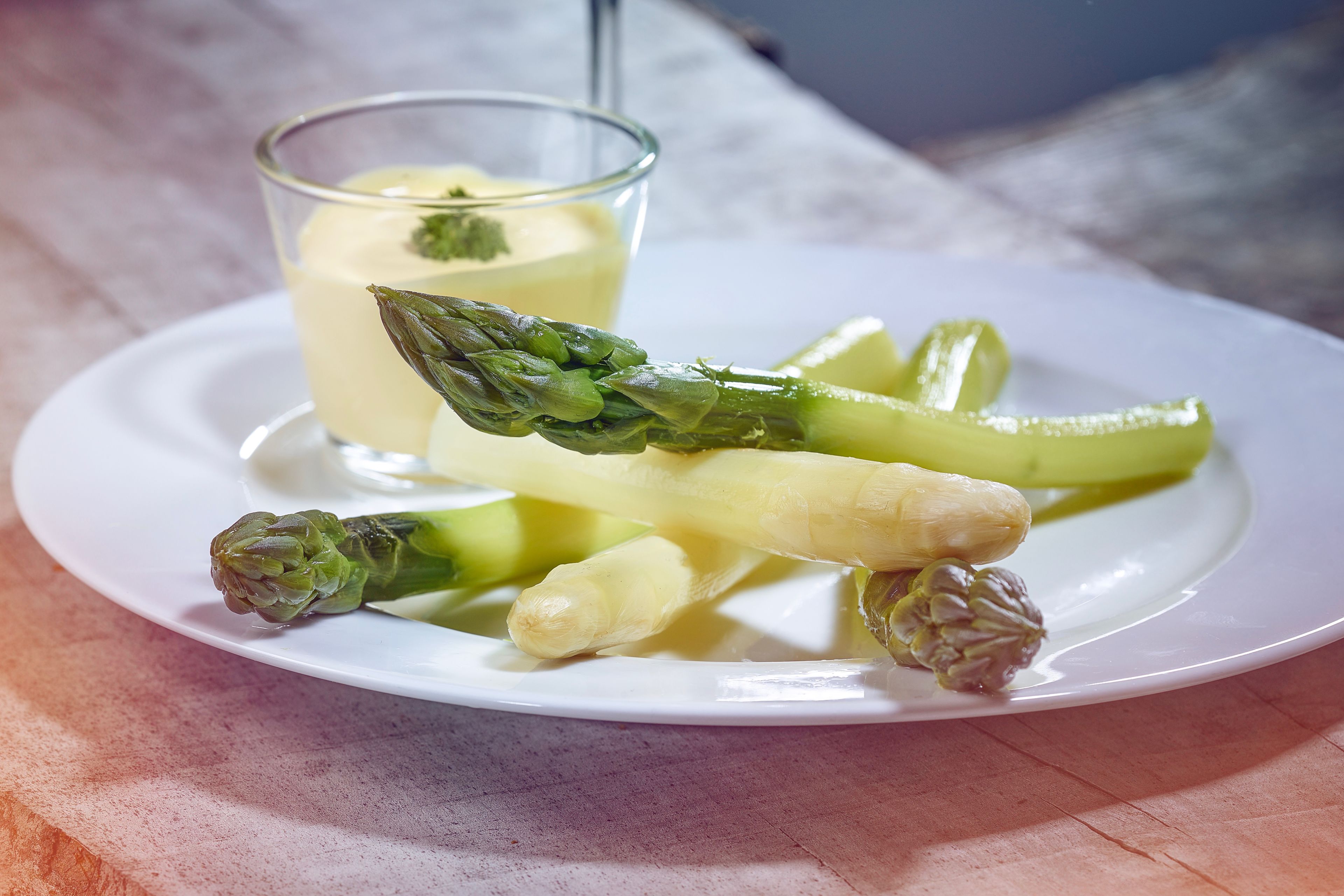 Asparagus on a plate with sauce