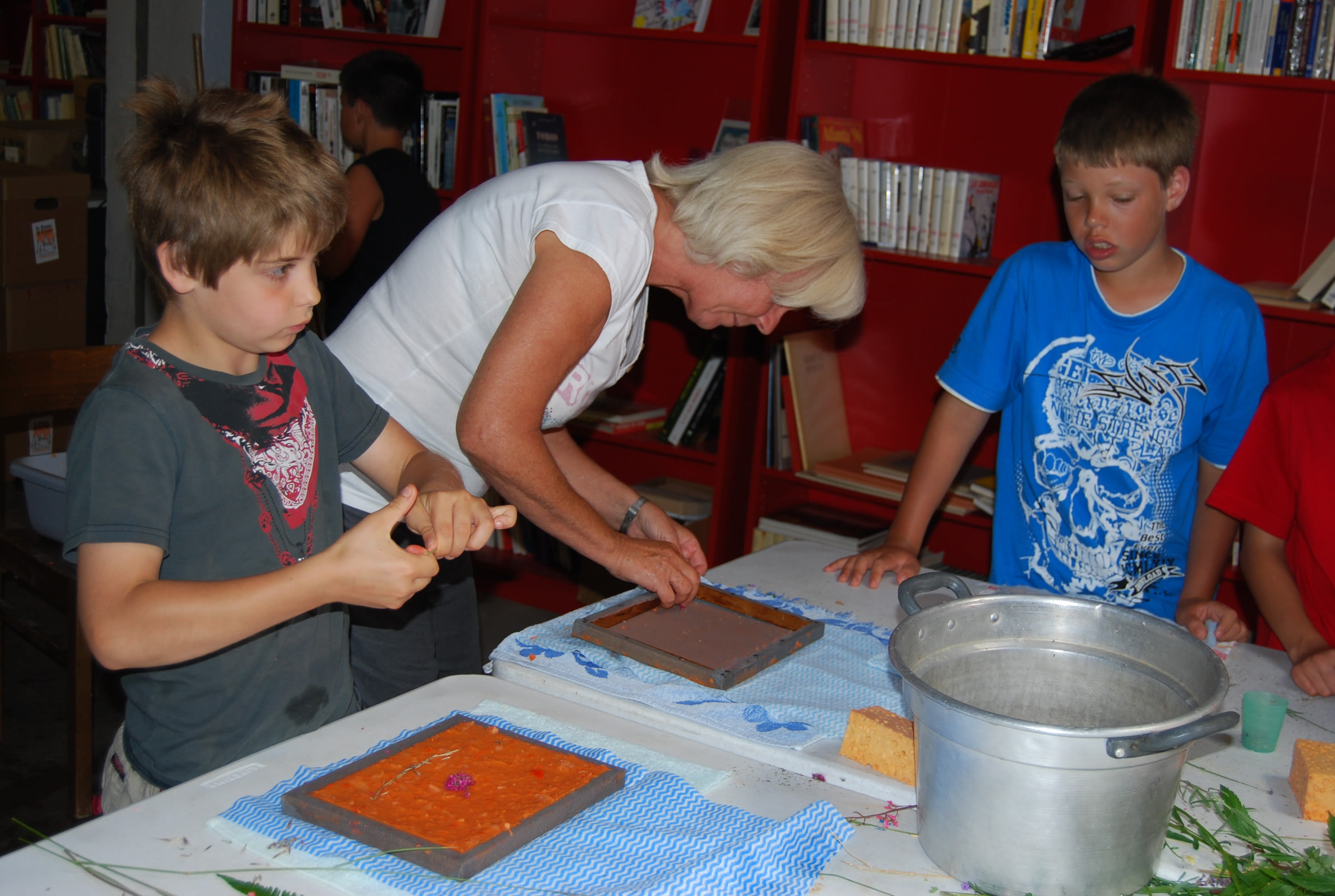 Woman doing a workshop with two children, Valais, Switzerland