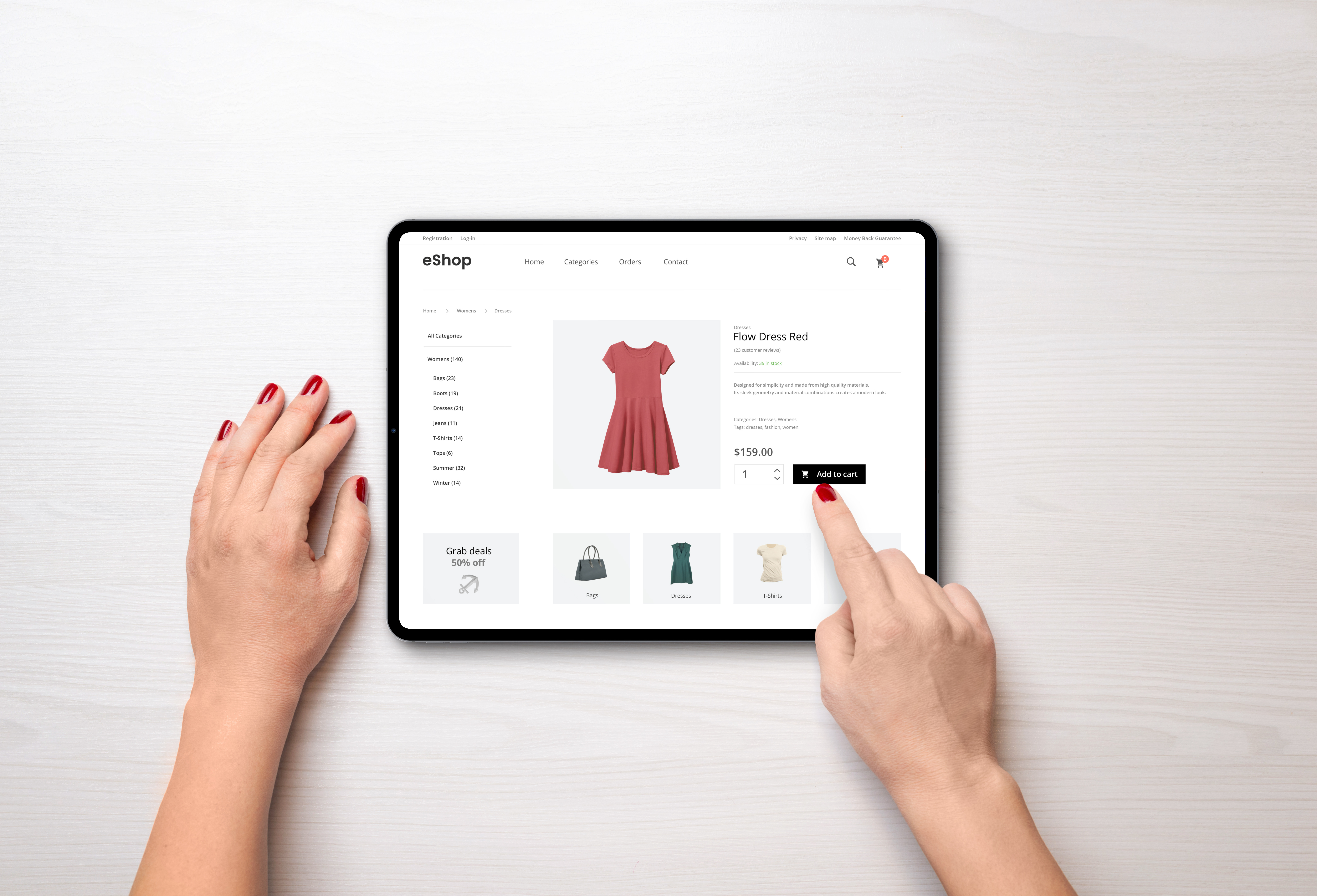 A user buying a red dress online with a tablet.