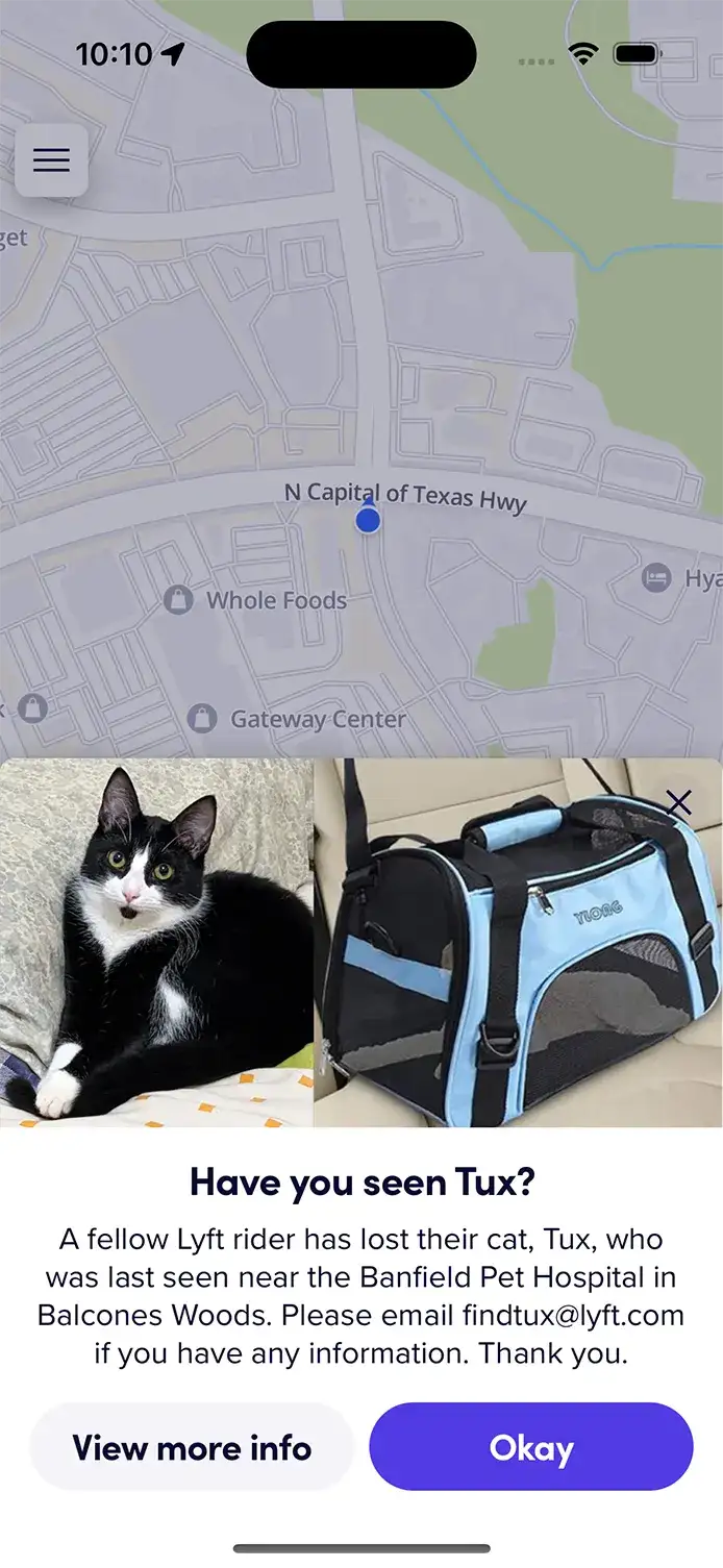 Mobile screenshot of a lost cat alert showing Tux near Balcones Woods, with images of the cat and carrier and a message to contact Lyft if seen.