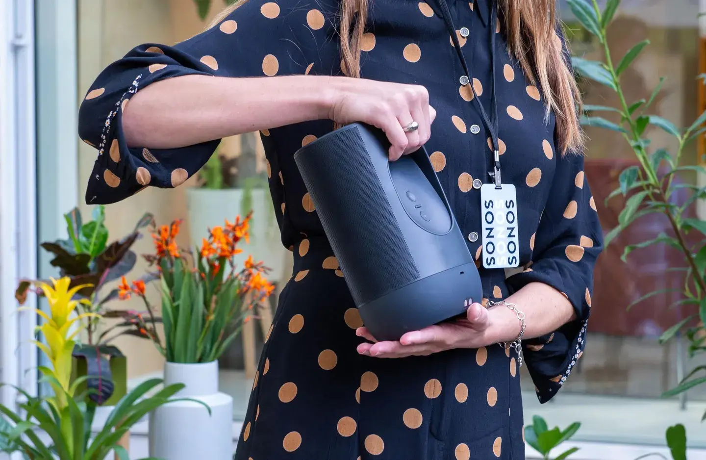 Image of a social media influencer showcasing Sonos speakers