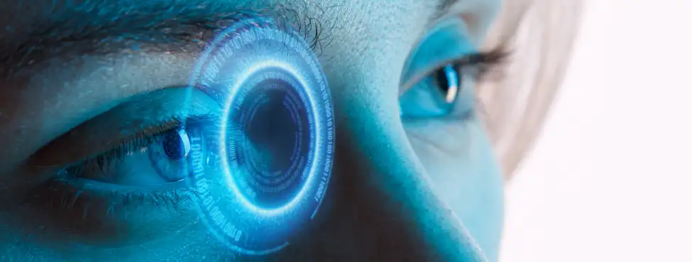 Close-up of a human eye with a glowing blue digital interface overlay, symbolizing artificial intelligence, augmented reality, or futuristic technology integration.