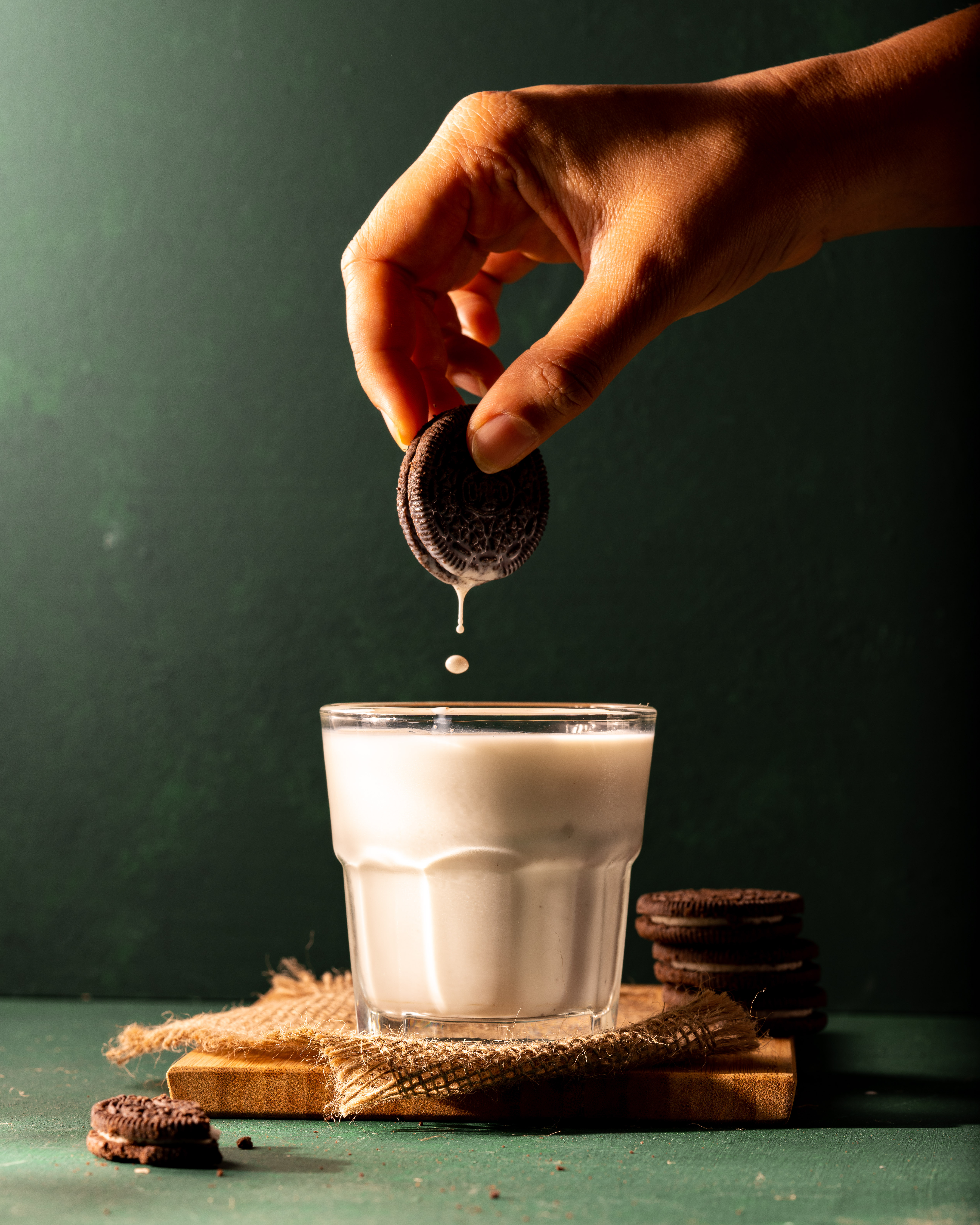 An Oreo biscuit being dipped in a glass of milk. Just like what happened in the Oreo Dunk challenge!