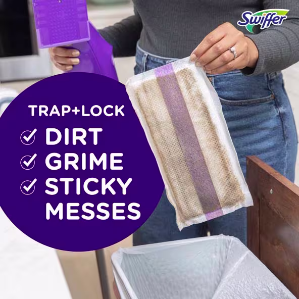 A person holds a Swiffer cloth above a trash can, showing its ability to trap dirt, grime, and sticky messes