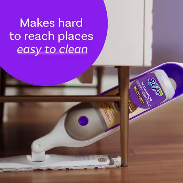Swiffer Power Mop cleaning hard-to-reach places under furniture on wooden floors. Easy to use for effortless cleaning