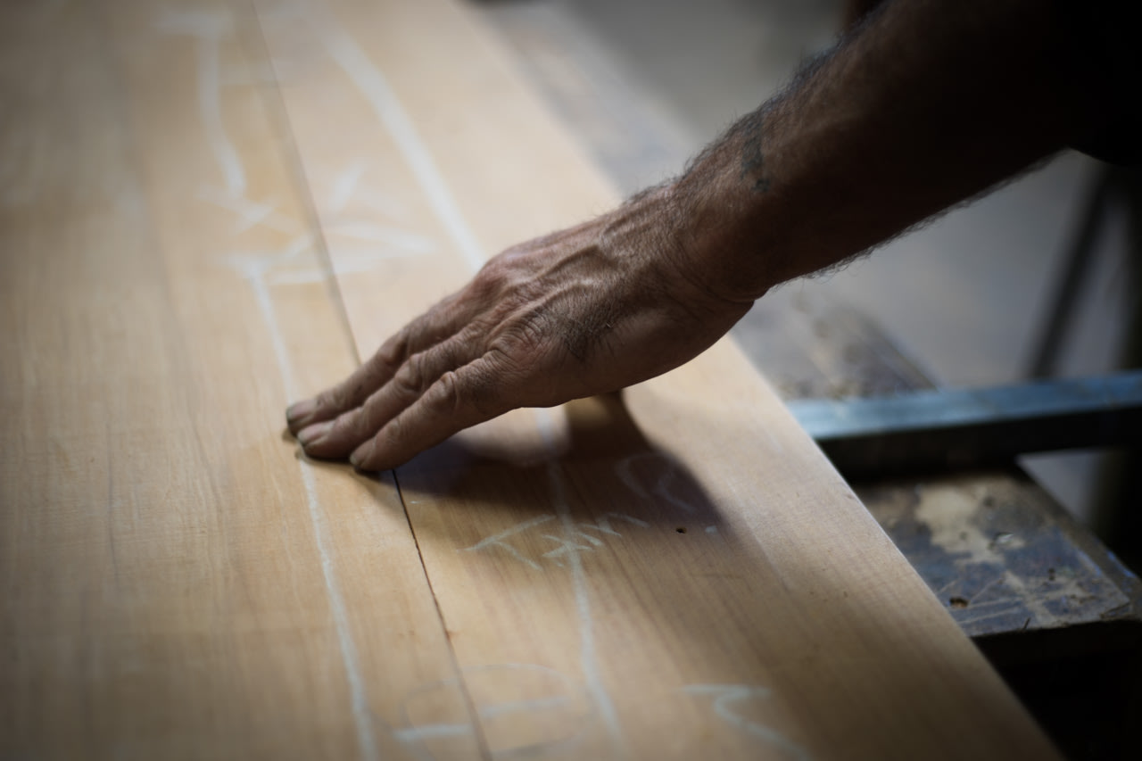 Tony hand on wooden surface