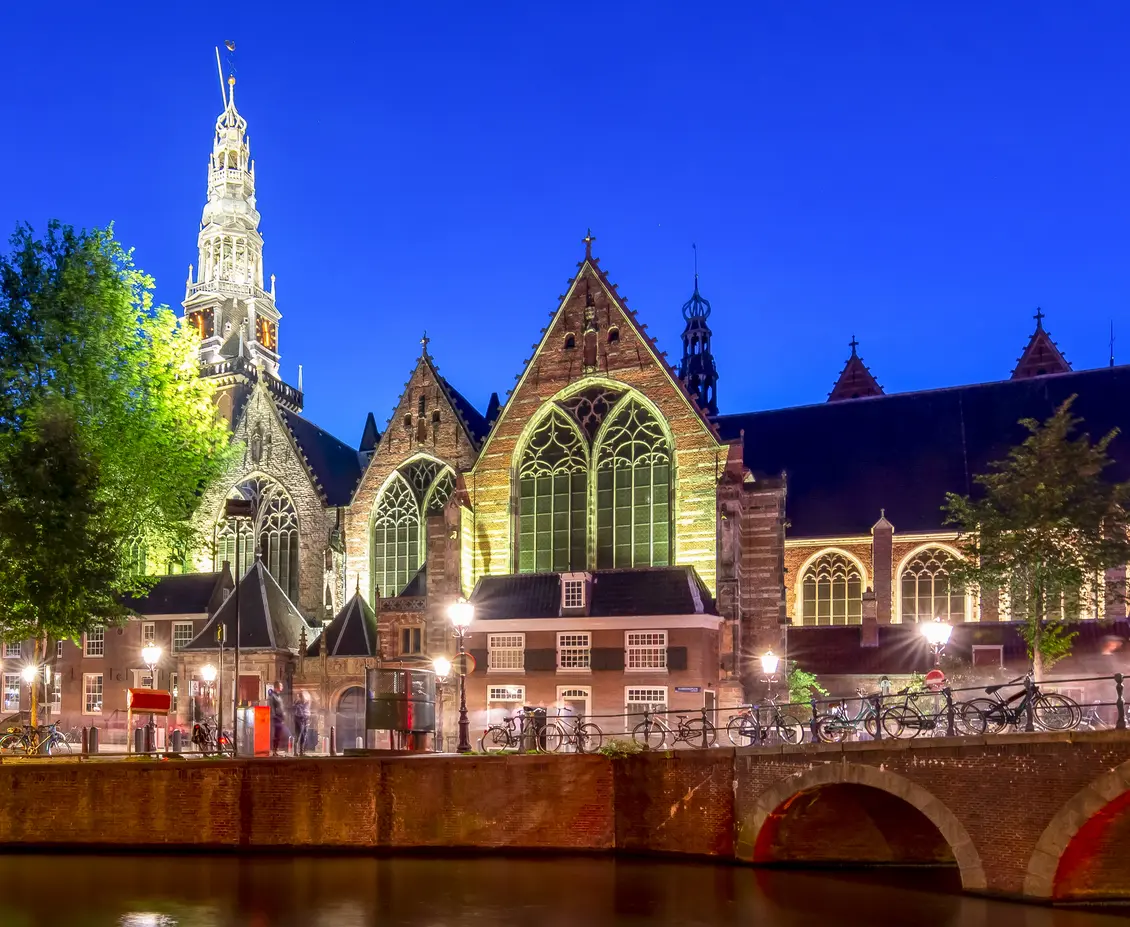 Canal in front of illuminated church