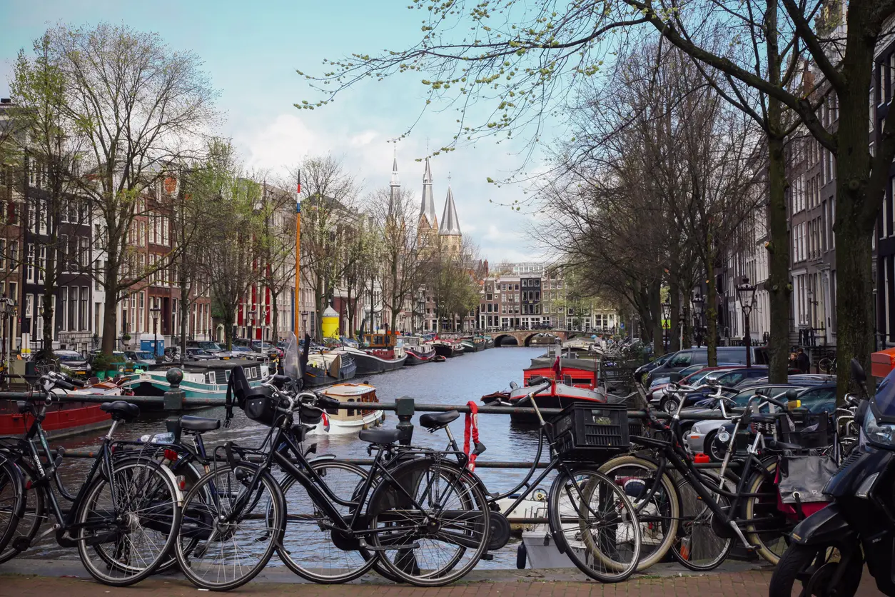 Bicycles on bridge over canal in Amsterdam