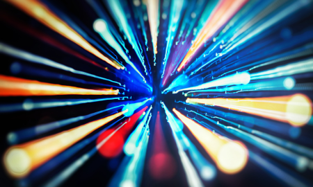 man at a laptop with microphone recording a podcast