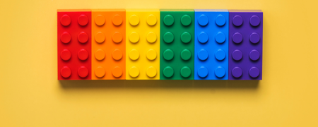 buildings blocks of various colour on a yellow background