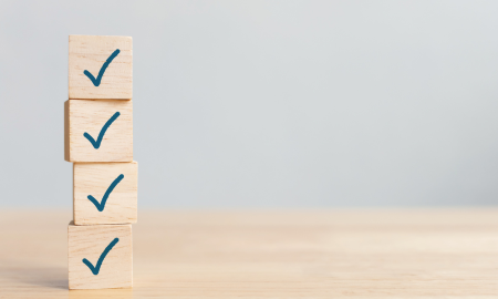 stack of wooden cubes with ticks on the side