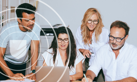 People working around a table collaborating
