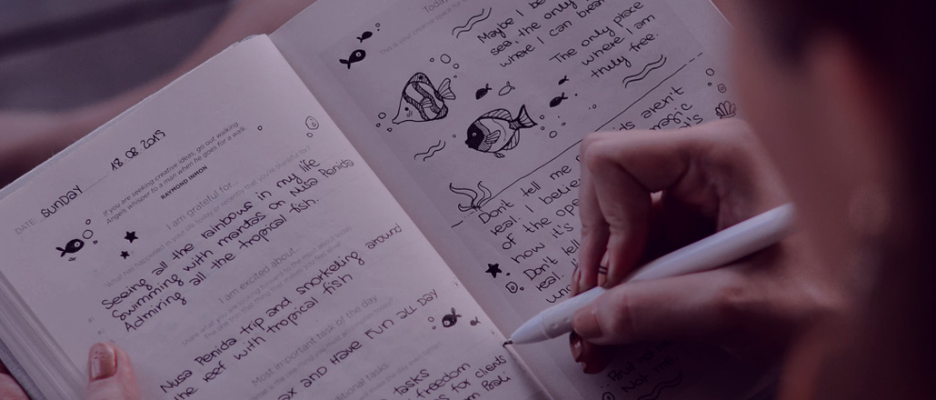 Woman taking time to reflect in her journal