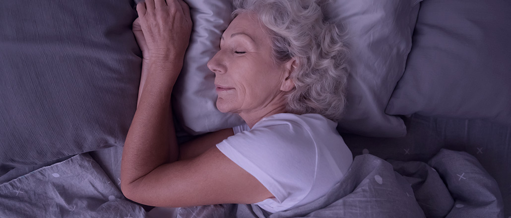 Older woman getting a good nights sleep