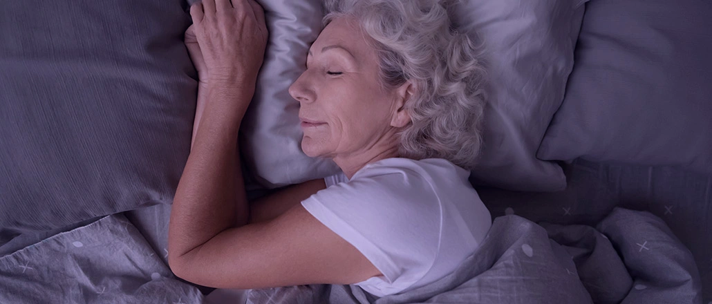 Older woman getting a good nights sleep