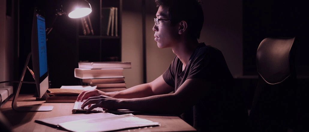 Student working all night to finish thesis