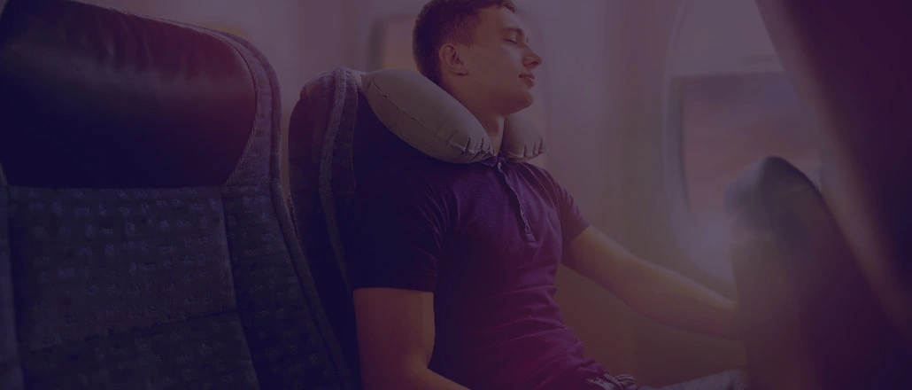 Young man resting during flight back home